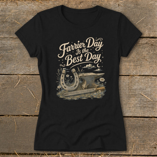 Black t-shirt with graphic "Farrier Day Is the Best Day" and anvil, horseshoe, file, and flowers.