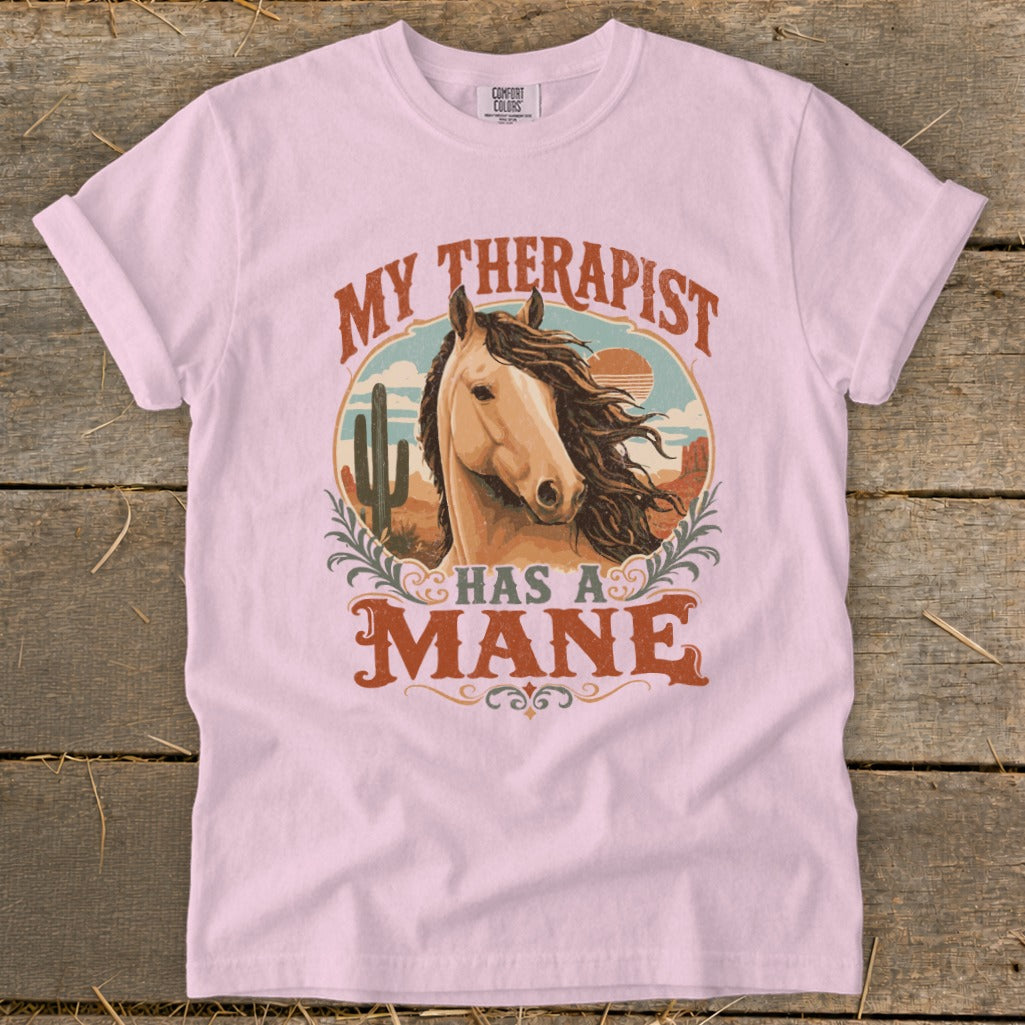 Pink t-shirt with "MY THERAPIST HAS A MANE" text and a horse portrait.