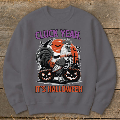 Rooster in skeleton costume with pumpkins and text "Cluck Yeah, It's Halloween".