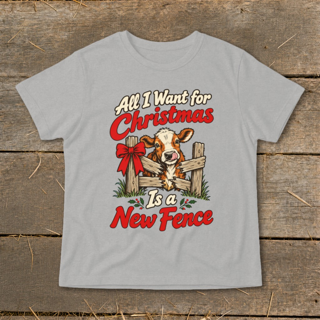 Gray t-shirt graphic with cow behind fence, "All I Want for Christmas Is a New Fence" text.