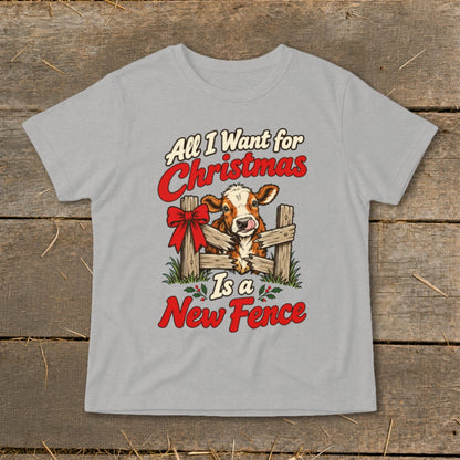 Gray t-shirt graphic with cow behind fence, "All I Want for Christmas Is a New Fence" text.