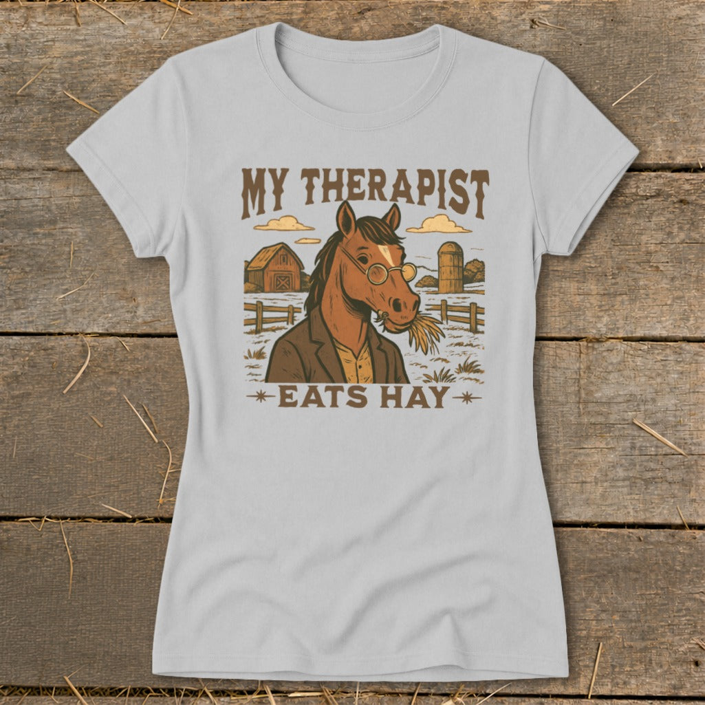 Light gray t-shirt with "MY THERAPIST EATS HAY" text and a horse illustration.