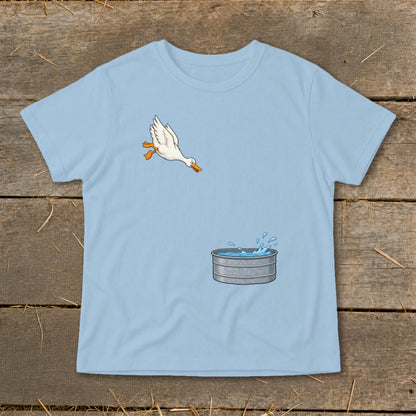 Light blue t-shirt with cartoon of a white duck jumping into a water trough.
