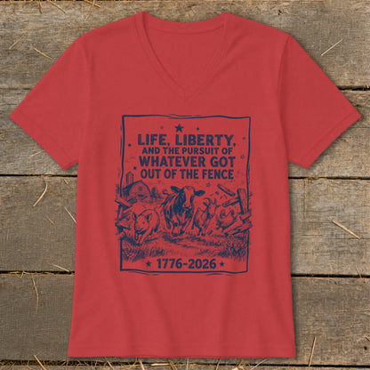 Red V-neck shirt with "LIFE, LIBERTY, AND THE PURSUIT OF WHATEVER GOT OUT OF THE FENCE 1776-2026" and farm animals.