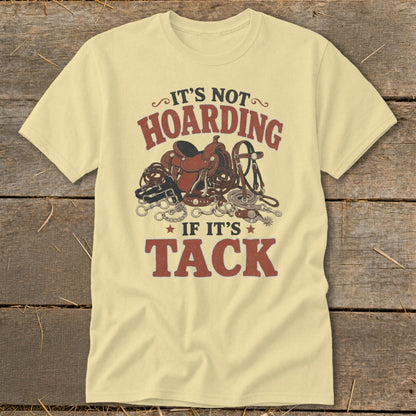 Light yellow t-shirt with "It's not hoarding if it's tack" and equestrian gear graphic.
