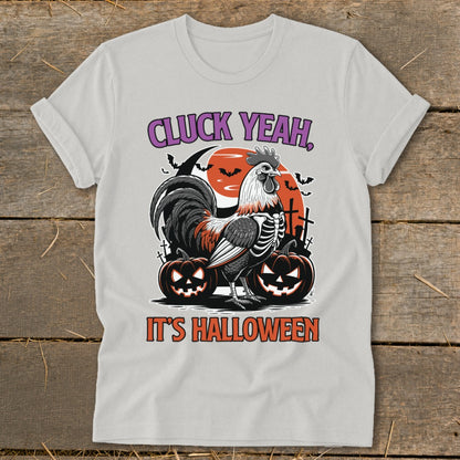 Rooster skeleton graphic with pumpkins and text "CLUCK YEAH, IT'S HALLOWEEN".