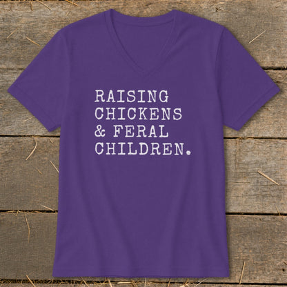 Purple v-neck t-shirt with white text: RAISING CHICKENS & FERAL CHILDREN.