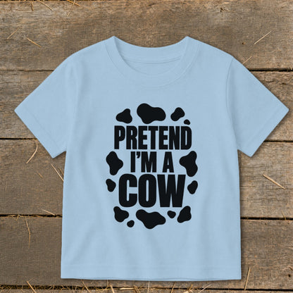 Light blue t-shirt with black "Pretend I'm a Cow" text and cow spots.