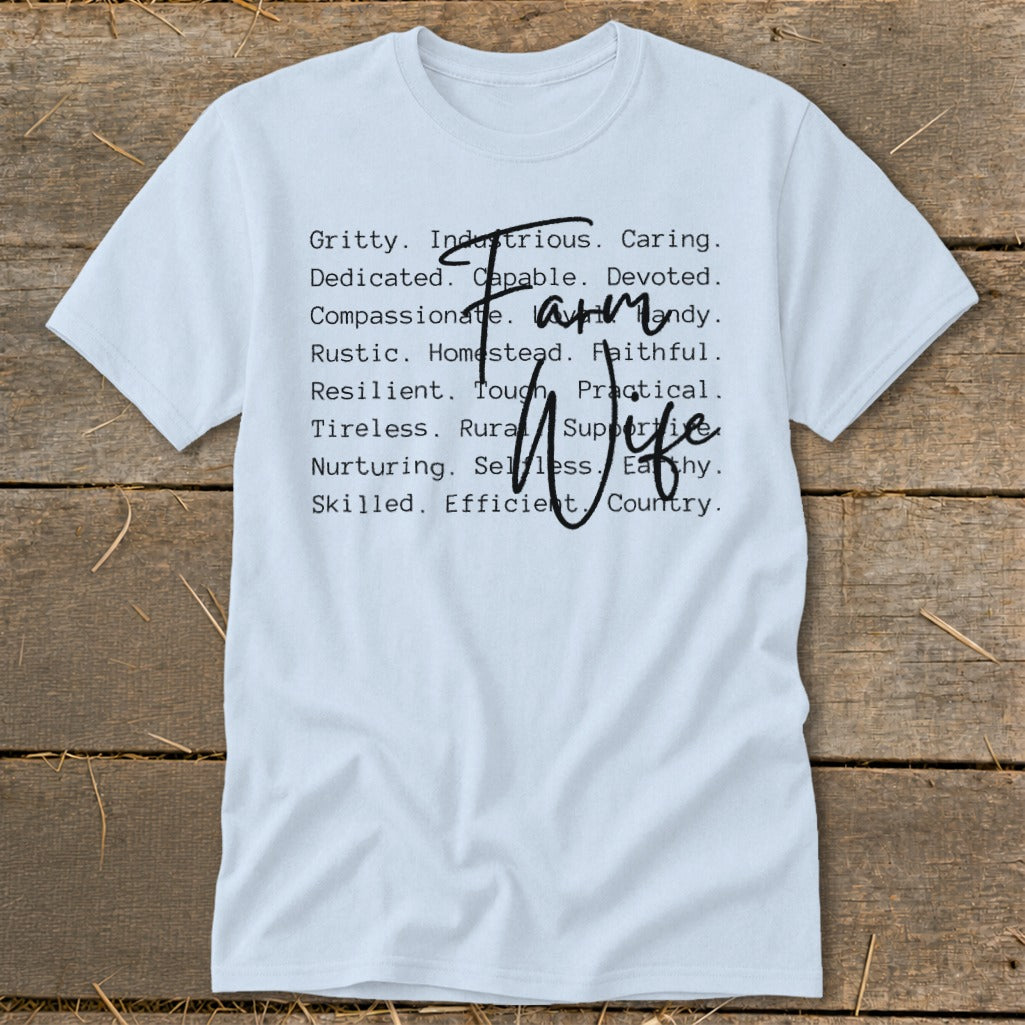 Light blue t-shirt with "Farm Wife" and descriptive words in black font.