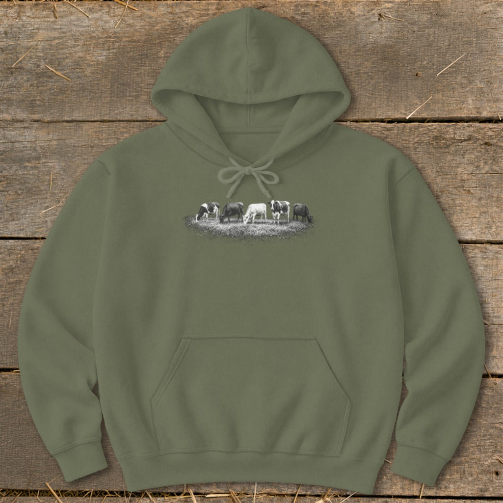 Olive green hoodie with a graphic of six cows grazing in a field.
