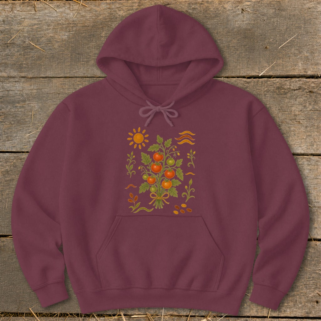 Maroon hoodie with embroidered tomato plant, sun, and wavy lines design.