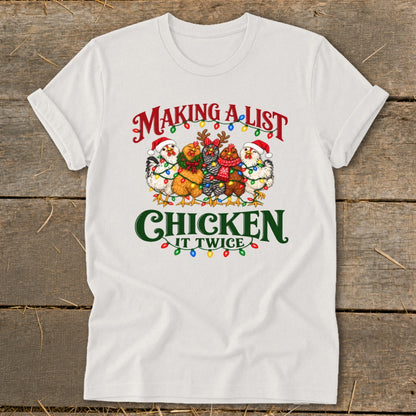 White t-shirt with "Making a list, chicken it twice" text and festive chickens.