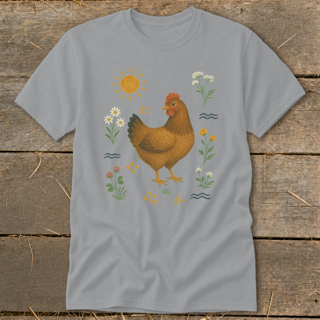 Grey t-shirt with a brown hen surrounded by flowers, clover, and a sun graphic.