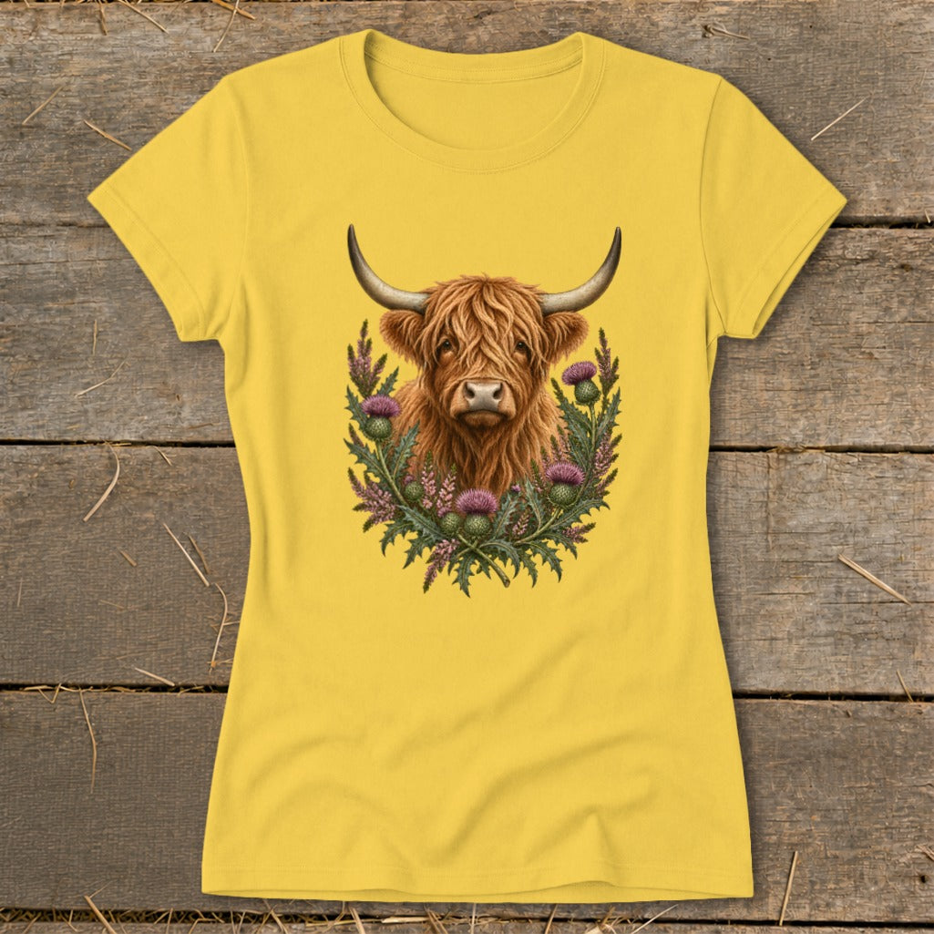 Yellow t-shirt with Highland cow and thistles graphic design.