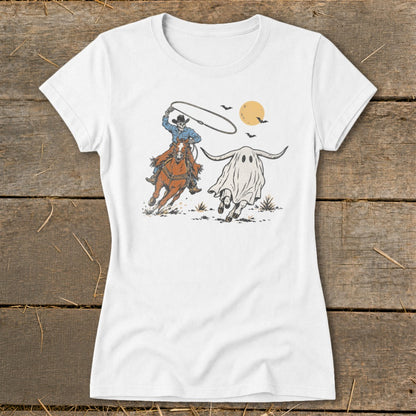 Skeleton cowboy on horseback lassos a ghost-shaped bull under a moonlit sky.