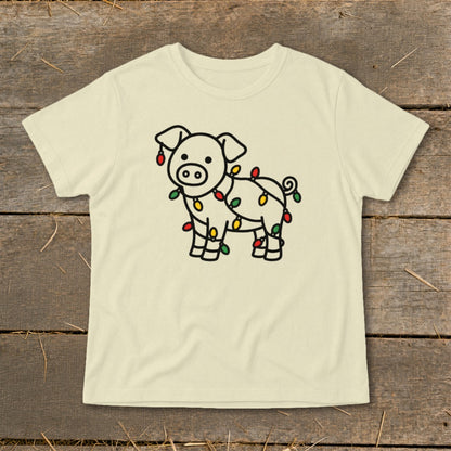 Cream-colored crewneck t-shirt featuring a black outline graphic of a pig tangled in colorful Christmas lights.