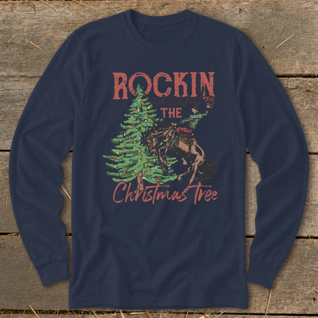 Navy long sleeve shirt with "Rockin around the Christmas Tree" text and cowboy on a bucking horse.