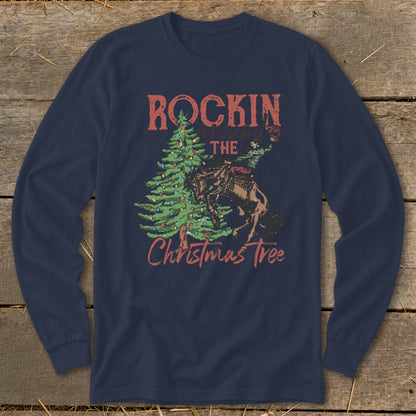 Navy long sleeve shirt with "Rockin around the Christmas Tree" text and cowboy on a bucking horse.