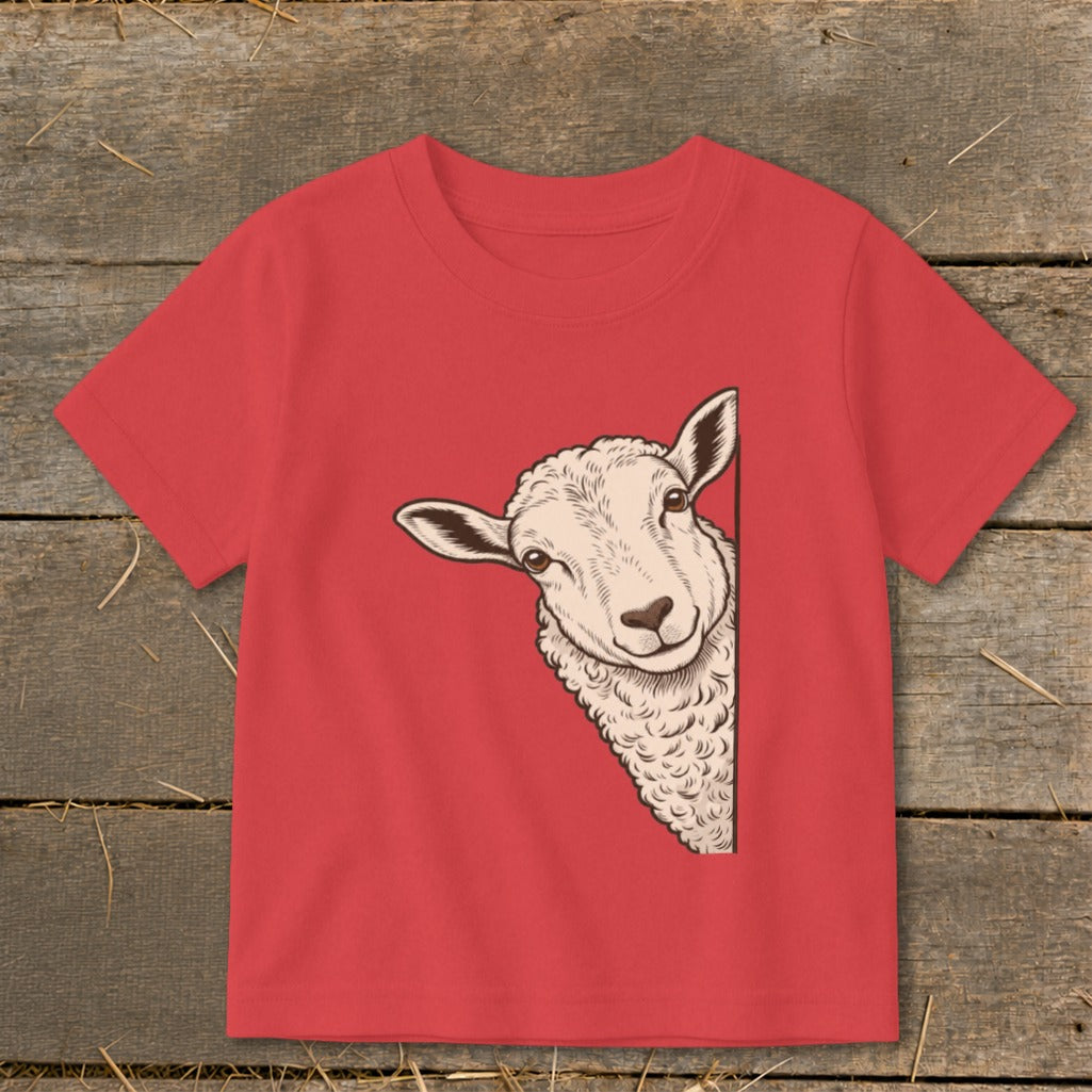 Red t-shirt with illustration of a sheep peeking from the side.