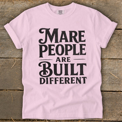 Light pink t-shirt with black text reading "Mare People Are Built Different".