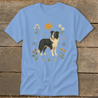 Light blue t-shirt featuring a border collie surrounded by a sun, flowers, and waves.