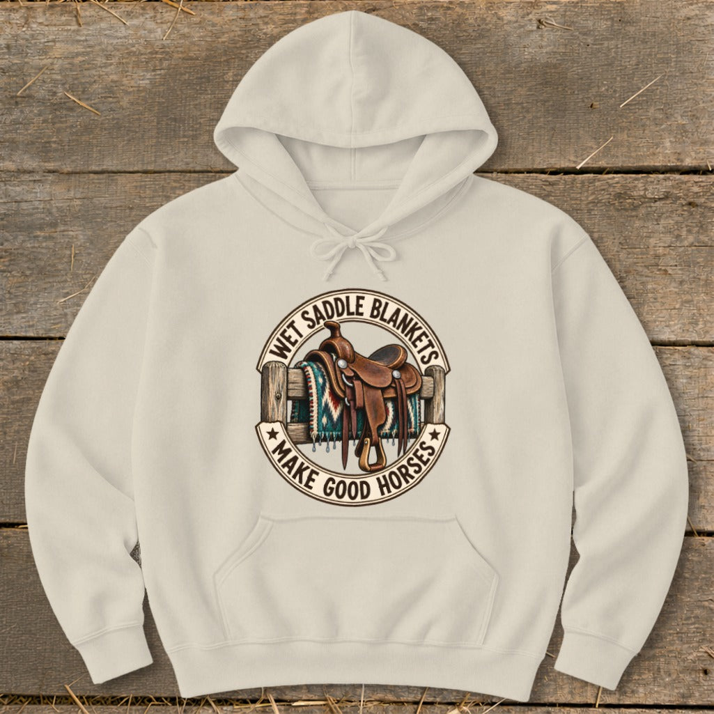 Cream hoodie with western graphic of saddle, blanket, and fence.