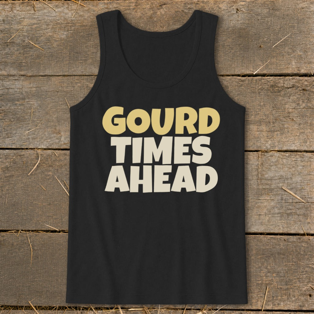 Black tank top featuring the text GOURD TIMES AHEAD in cream and yellow lettering, laid flat on a rustic wooden background.