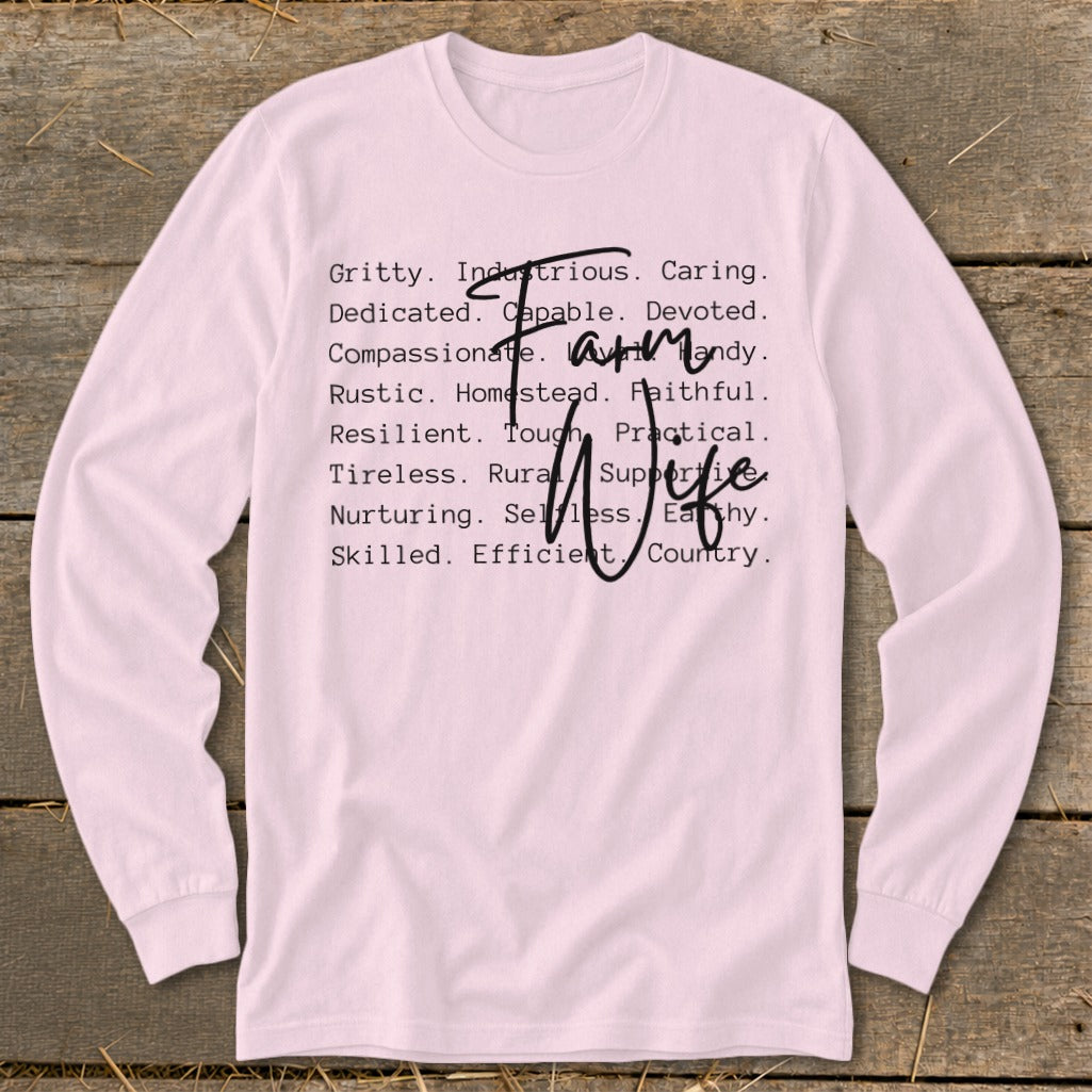 Pink long sleeve shirt with "Farm Wife" and descriptive words in black text.