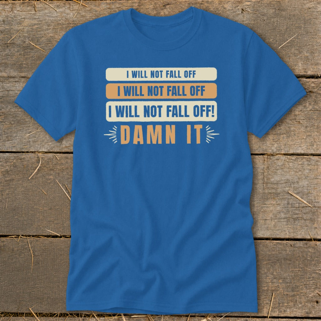 Blue t-shirt with white, orange, and blue text reading "I WILL NOT FALL OFF" and "DAMN IT".