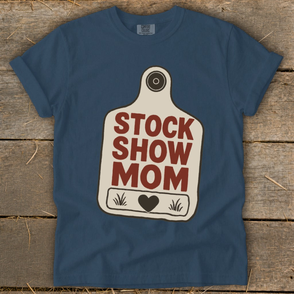 Blue t-shirt with "STOCK SHOW MOM" text in a tag design.
