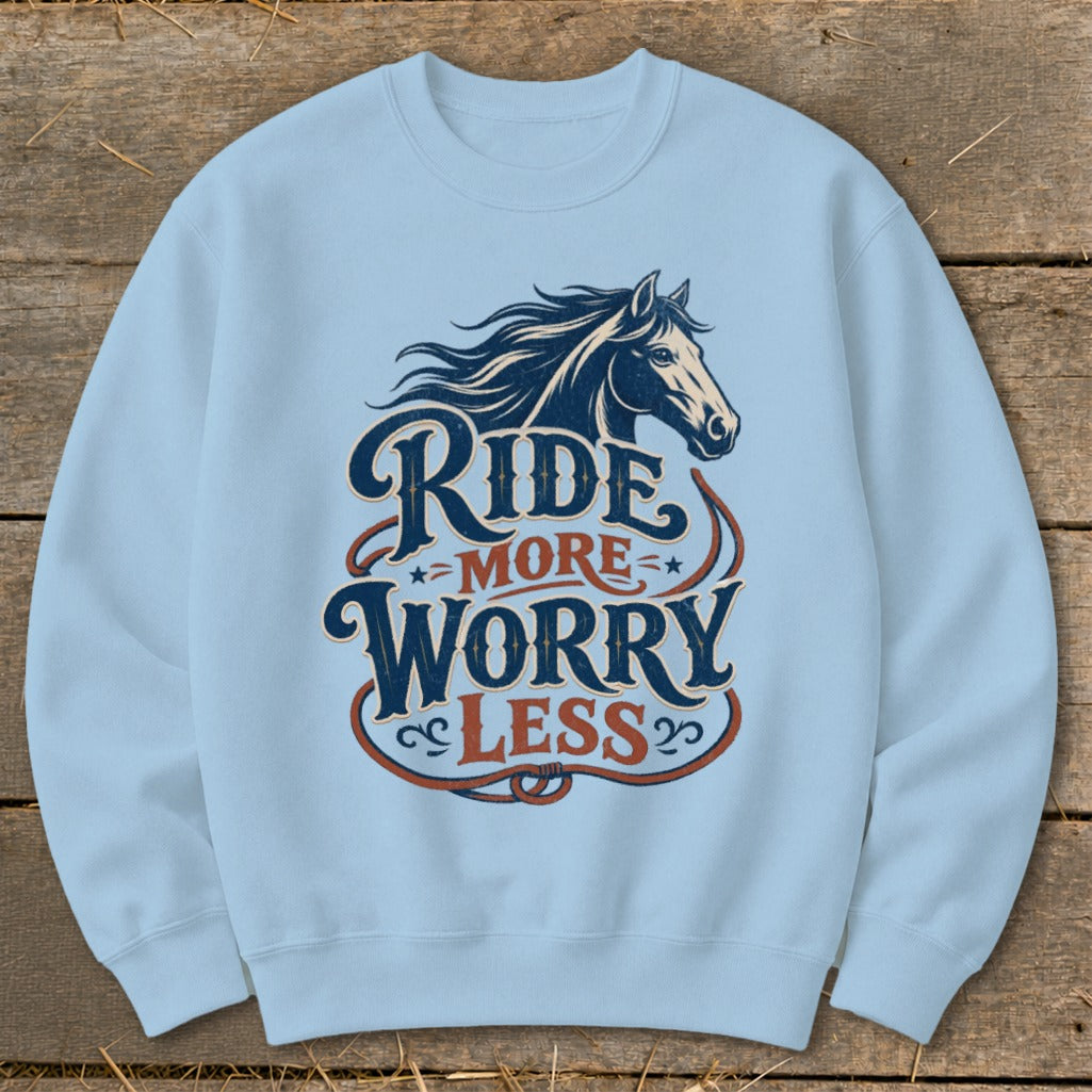 Light blue sweatshirt with "Ride More Worry Less" text and horse graphic.