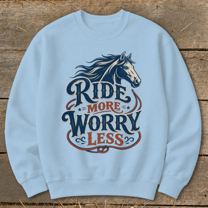 Light blue sweatshirt with "Ride More Worry Less" text and horse graphic.