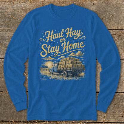 Blue long sleeve shirt with "Haul Hay or Stay Home" text and truck loaded with hay bales.