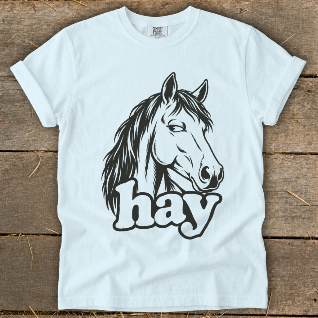 White t-shirt with black horse head graphic and "hay" text.