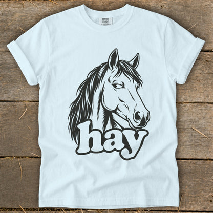 White t-shirt with black horse head graphic and "hay" text.