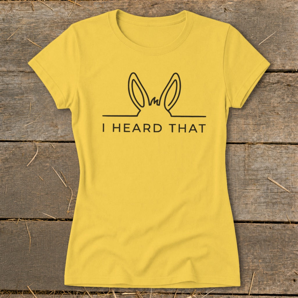Yellow t-shirt with black outline of donkey ears and text "I HEARD THAT".