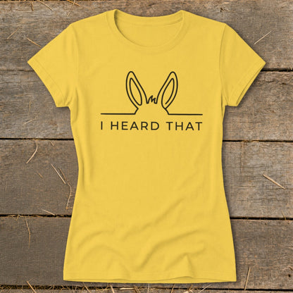 Yellow t-shirt with black outline of donkey ears and text "I HEARD THAT".
