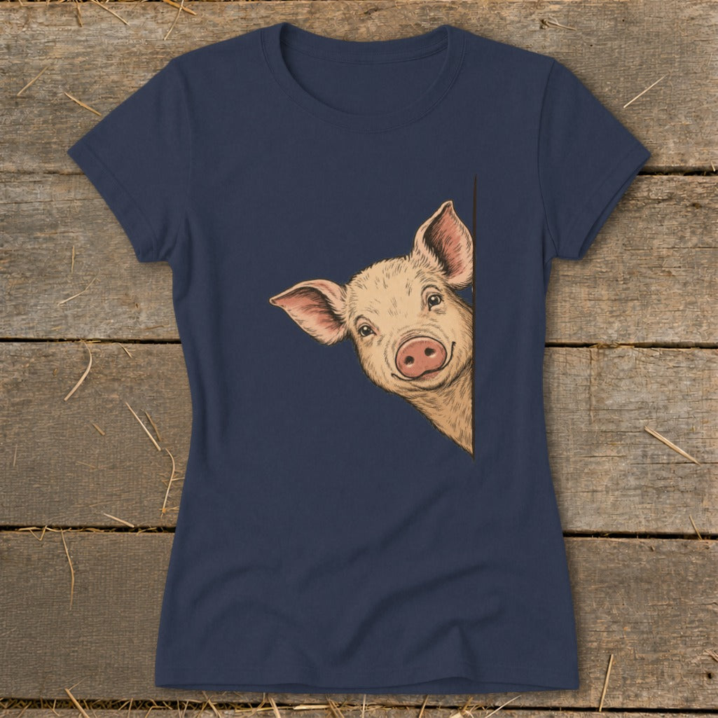 Navy t-shirt with a drawing of a smiling pig peeking from the right.