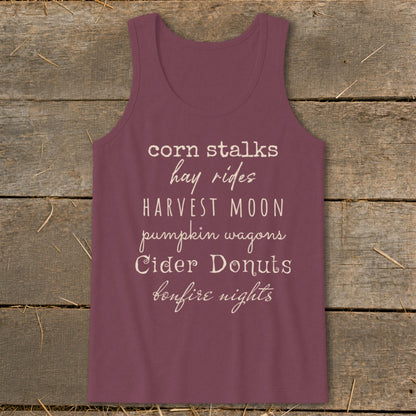 Burgundy tank top with text: corn stalks, hay rides, Harvest Moon, pumpkin wagons, Cider Donuts, bonfire nights.