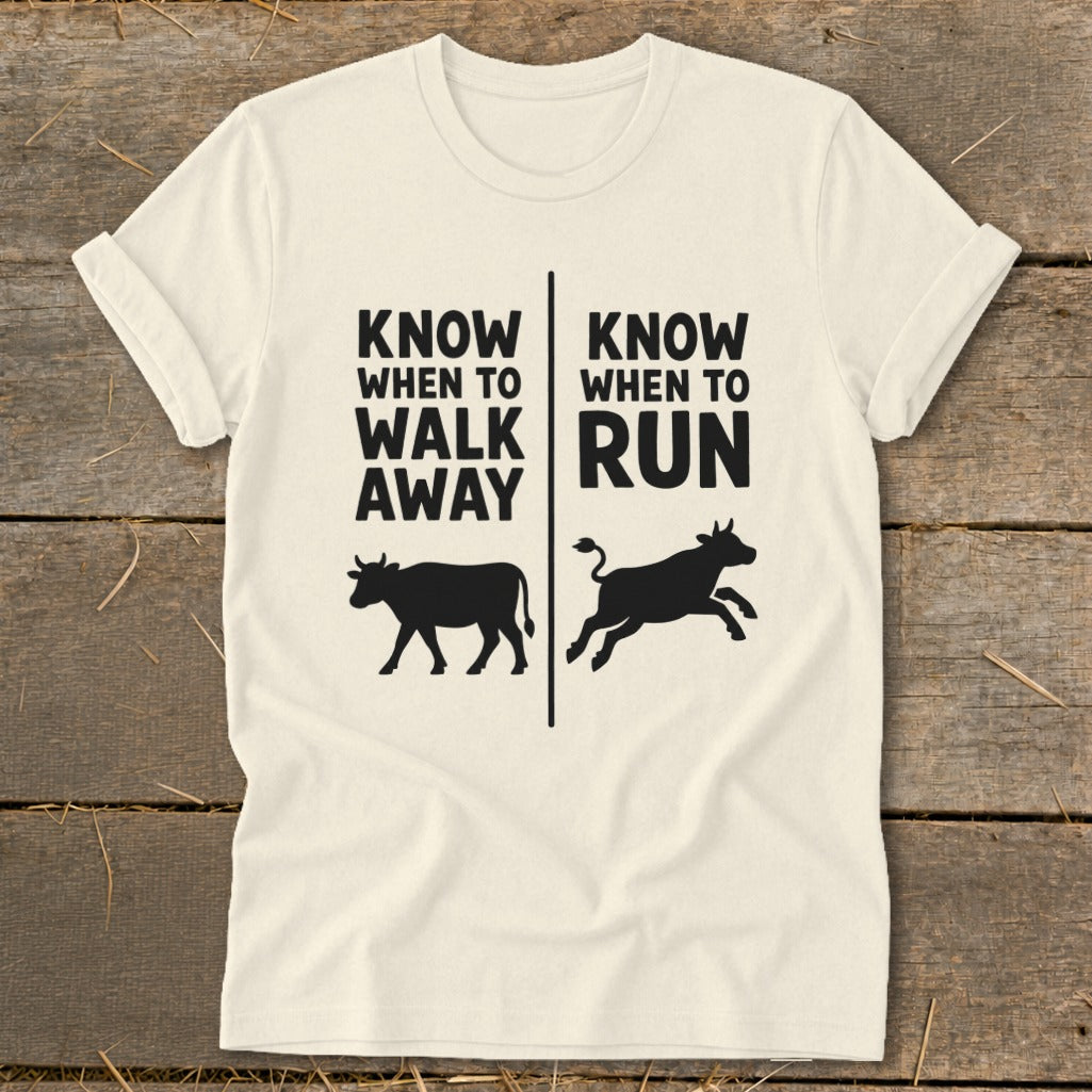 T-shirt with text "KNOW WHEN TO WALK AWAY" and "KNOW WHEN TO RUN" with cow graphics.