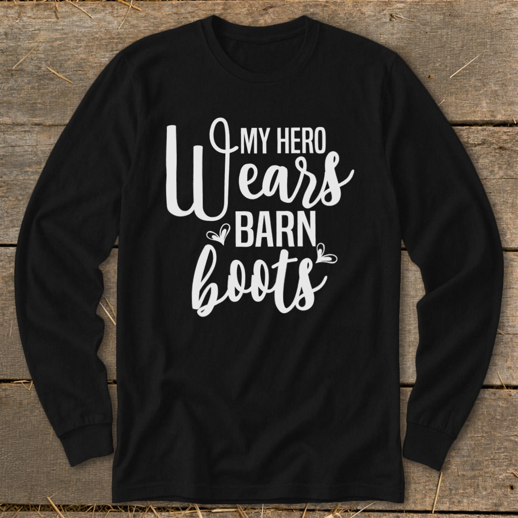 Black long sleeve shirt with white text reading "My Hero Wears Barn Boots".