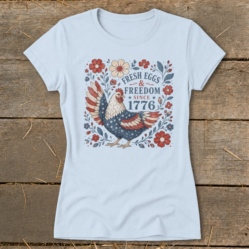 T-shirt with a chicken design featuring "FRESH EGGS & FREEDOM SINCE 1776".