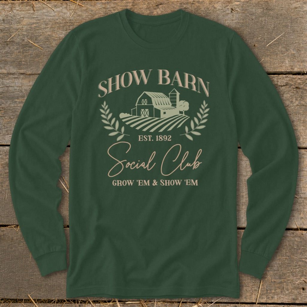 Green long sleeve shirt with "Show Barn Social Club" and farm graphic.