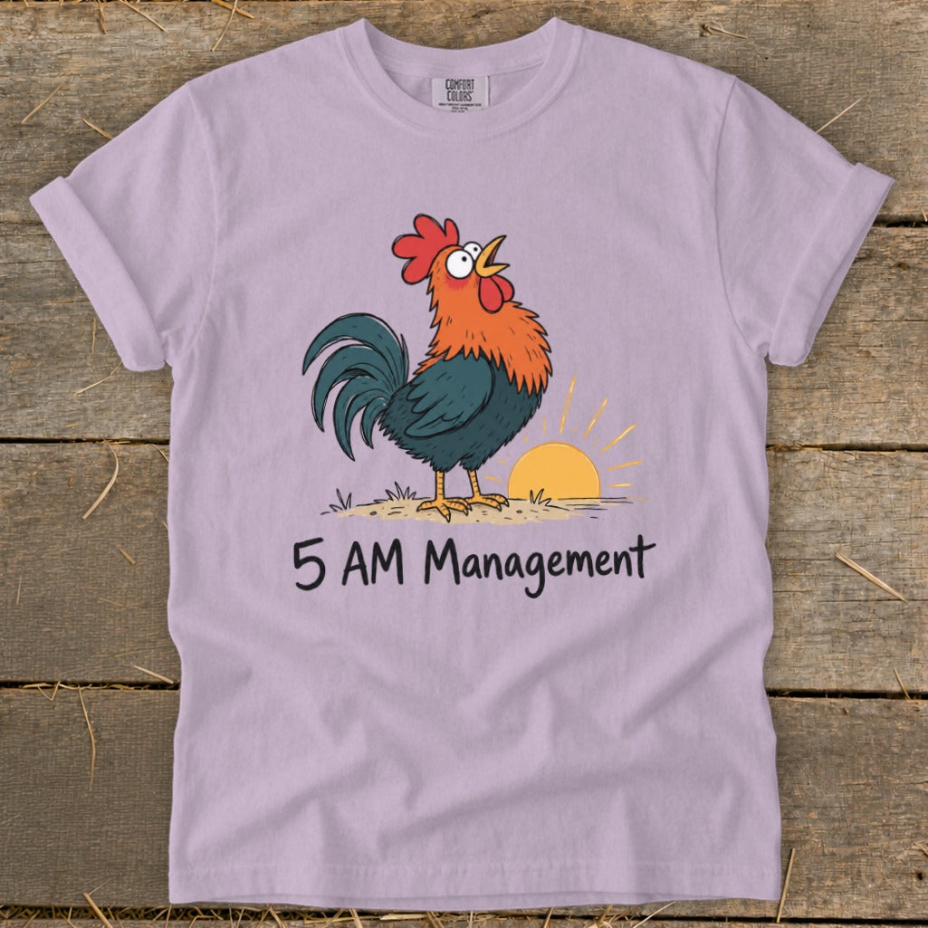 Lavender t-shirt with cartoon rooster crowing at sunrise and text "5 AM Management"