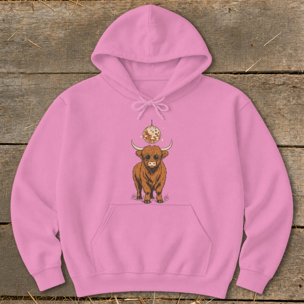 Pink hoodie with a Highland cow and disco ball graphic.