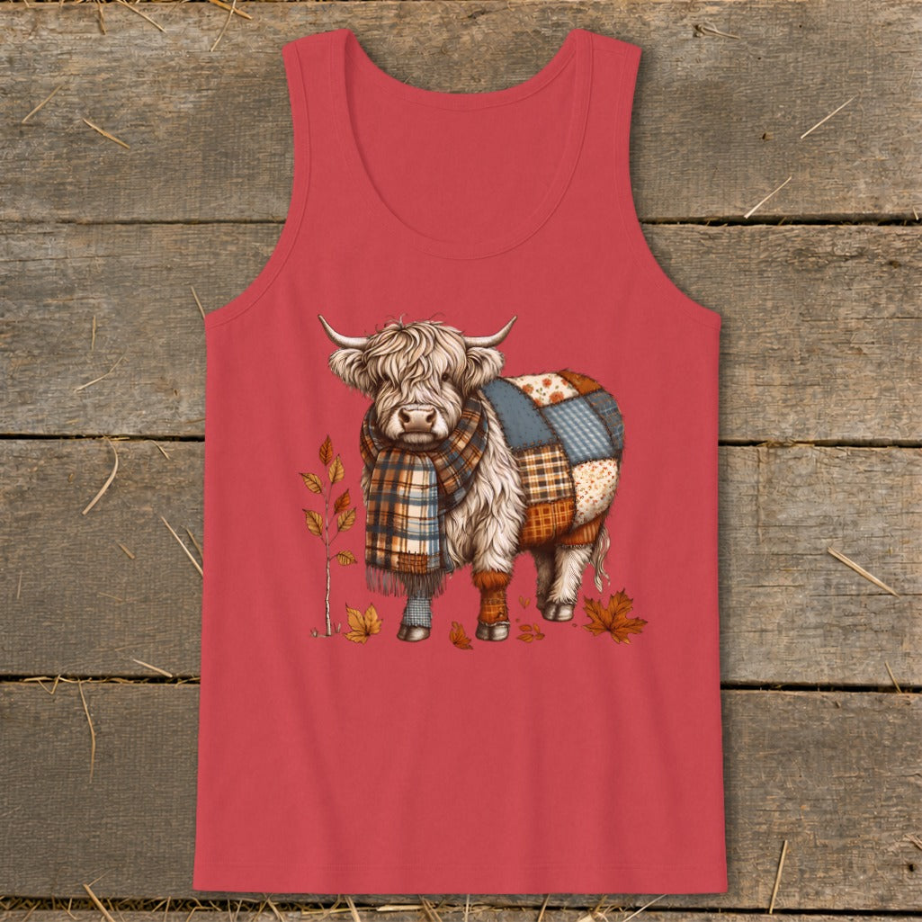 Highland cow with patched body, scarf, and autumn leaves on red tank top.