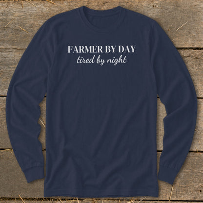 Navy long sleeve shirt with "FARMER BY DAY tired by night" in white text.