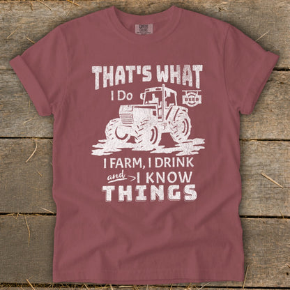 Maroon t-shirt with distressed graphic: "That's What I Do. I Farm, I Drink, and I Know Things."