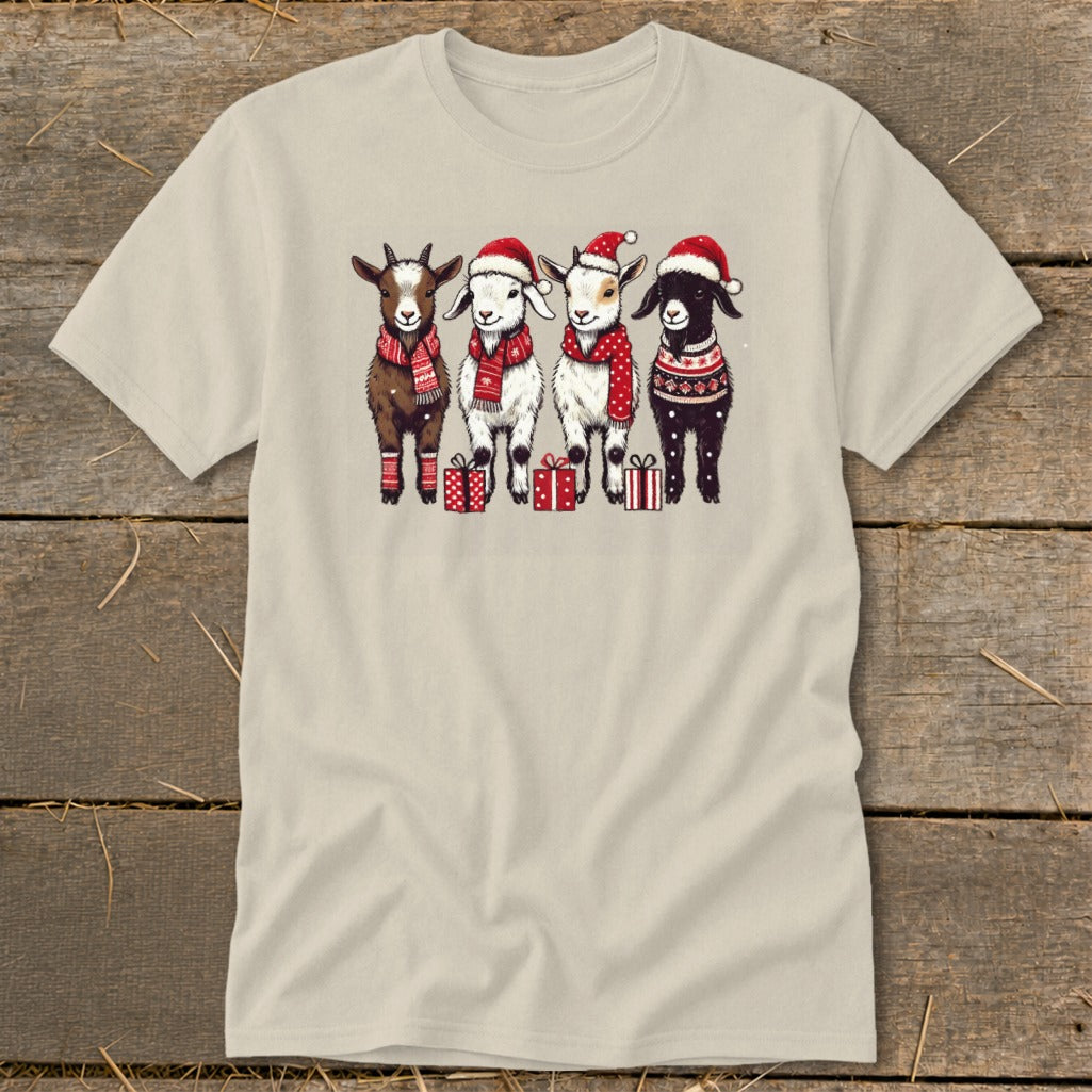 Four goats in Santa hats and festive scarves stand with presents.