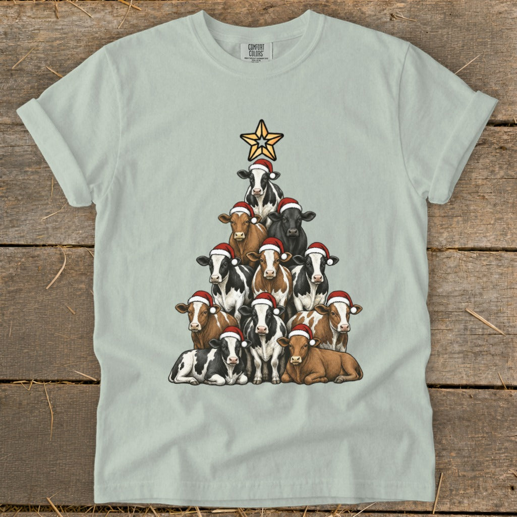 T-shirt with cows wearing Santa hats forming a Christmas tree with a star.